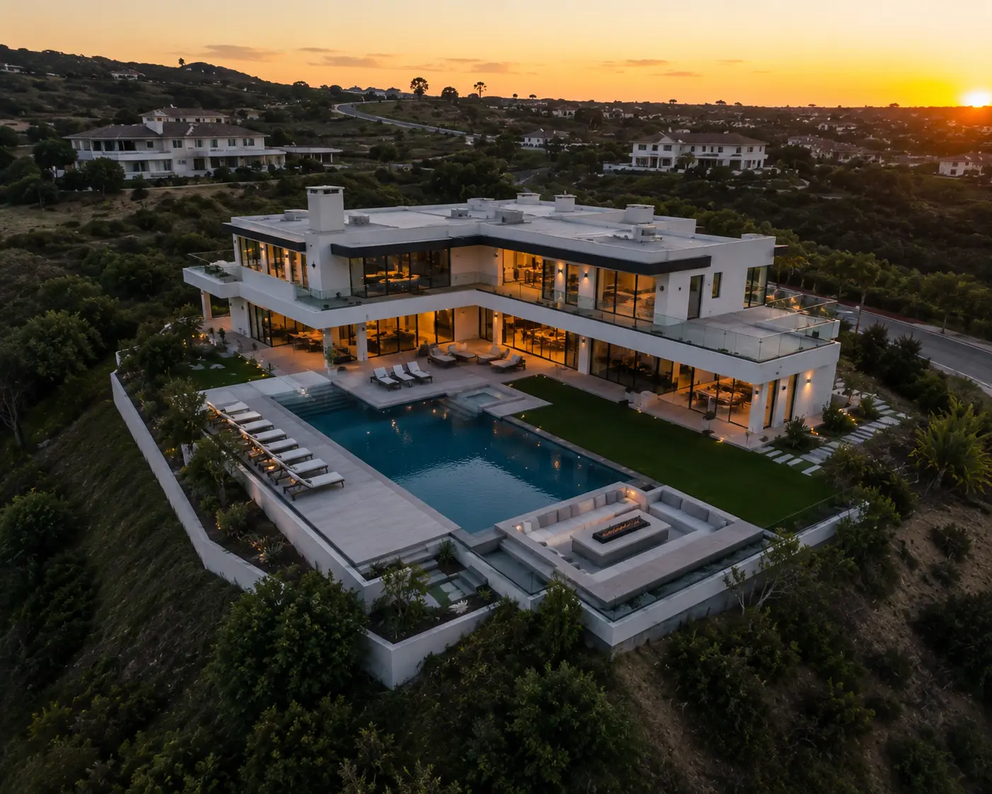 Modern luxury hillside estate at sunset